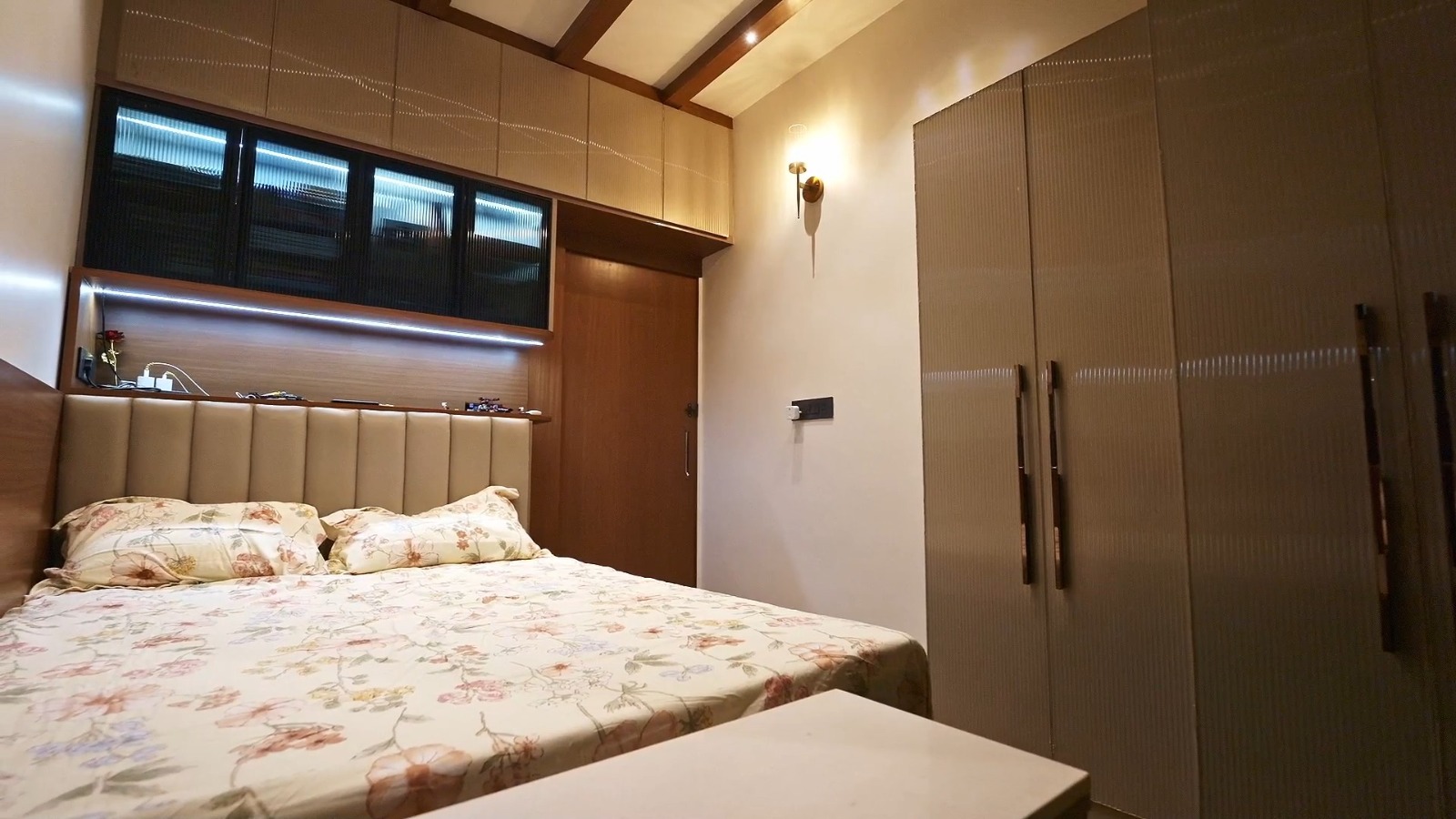 Modern master bedroom interior with upholstered back panel